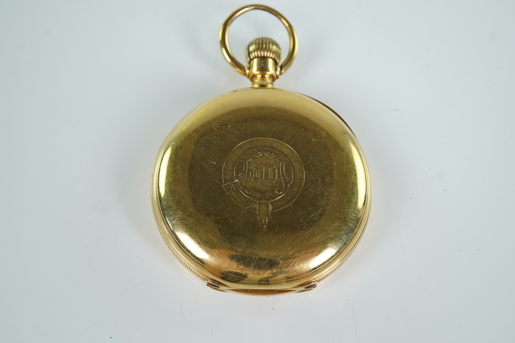 A late Victorian engine turned 18ct gold open faced keyless pocket watch by The American Waltham Watch Company